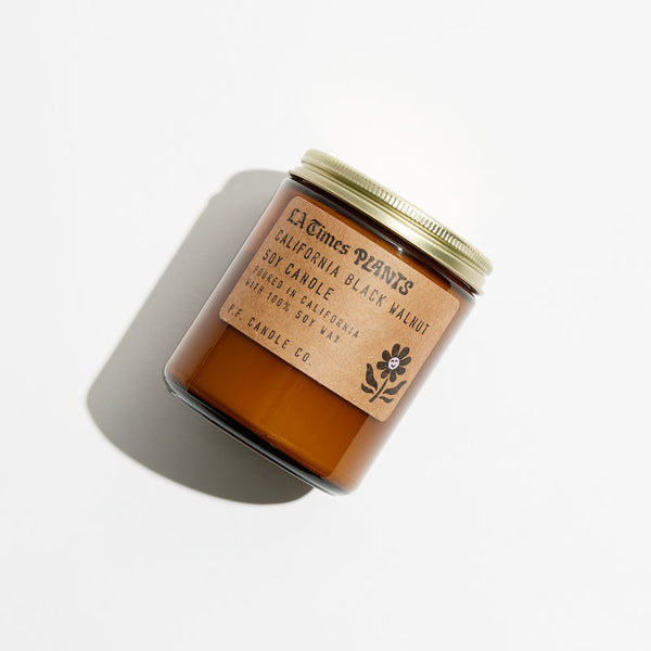 P.F. Candle Co. California Black Walnut for LA Times Plants Standard Candle - Product - Hand-poured into apothecary inspired amber jars with our signature kraft label and a brass lid.